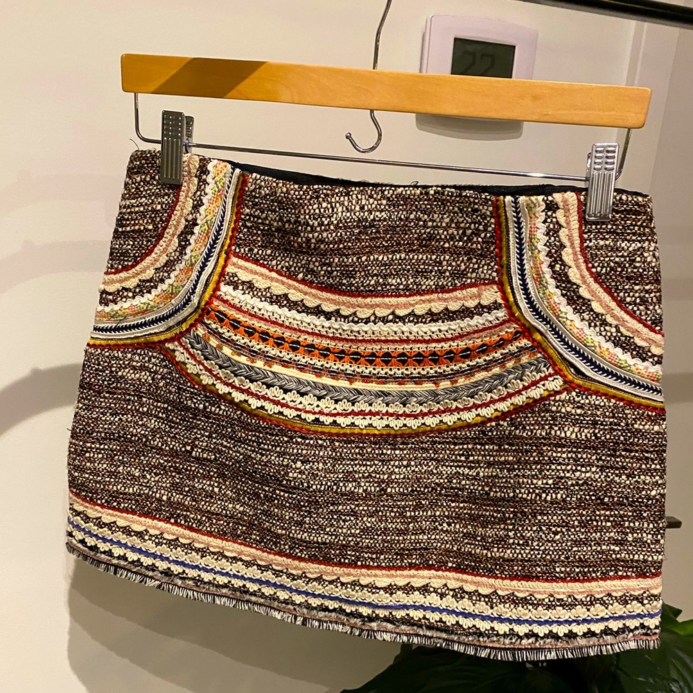 Embroidered mini skirt with tweed and woven detail.